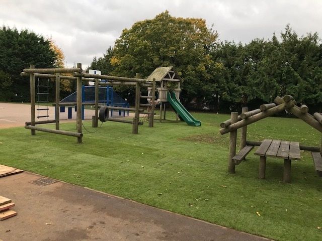 New turf laid around school play equipment