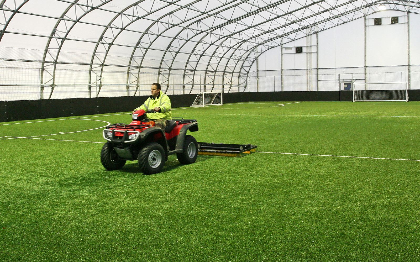 Operative maintaining the surface around play equipment