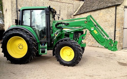 Green Scythe tractor with front loader